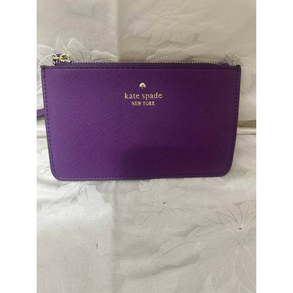 New Kate Spade New York purple pouch wristlet. B-300