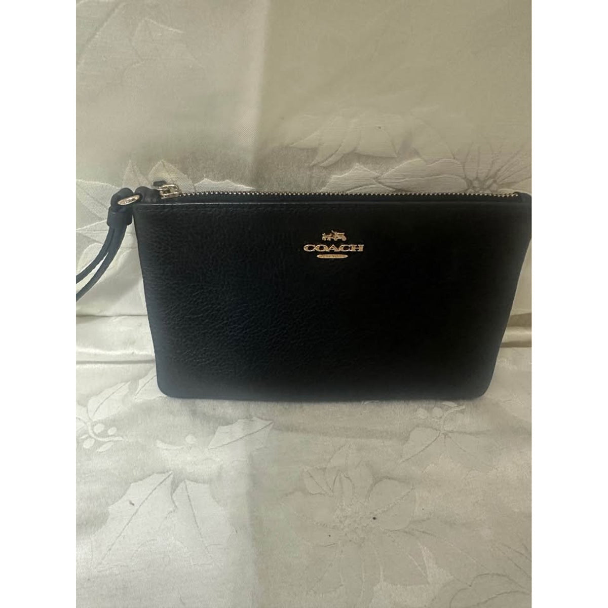 Pre-loved Coach Black Pebbled Leather Wristlet. B-303